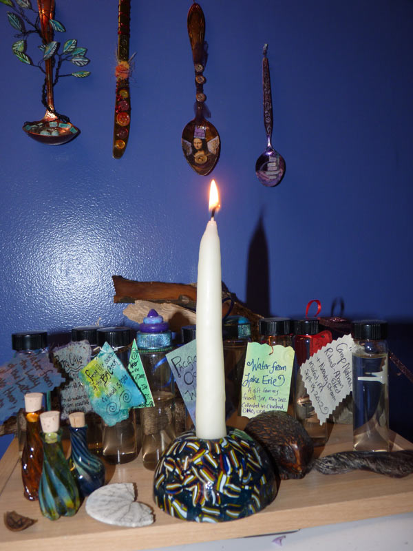 Candle burning on shrine