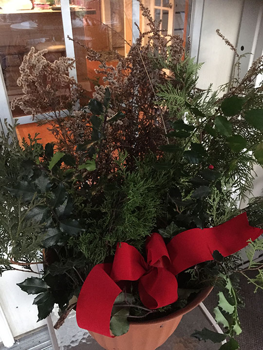 A simple outdoor basket -- greenery and a bow