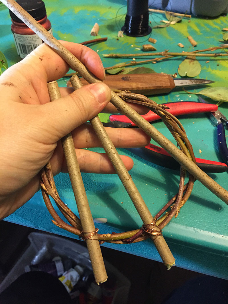 Cutting branches for an awen symbol