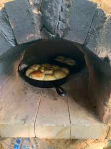 Breads baking in cast iron in the oven