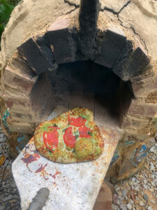 Amazing flatbread pizza with our own leek scape pesto and tomatoes from the garden, local organic milled flour