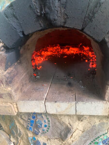 Ring of coals--ready to bake pizzas at very high heat!