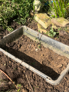 Gravel from the hole, now in the bottom of the pool for drainage.